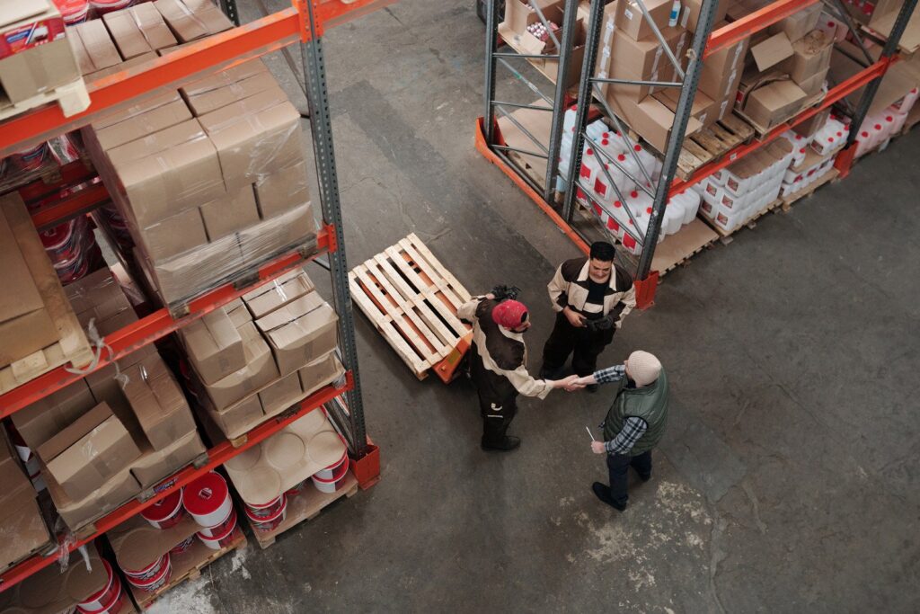Amazon FBA warehouse workers managing inventory storage with modern optimization tools
