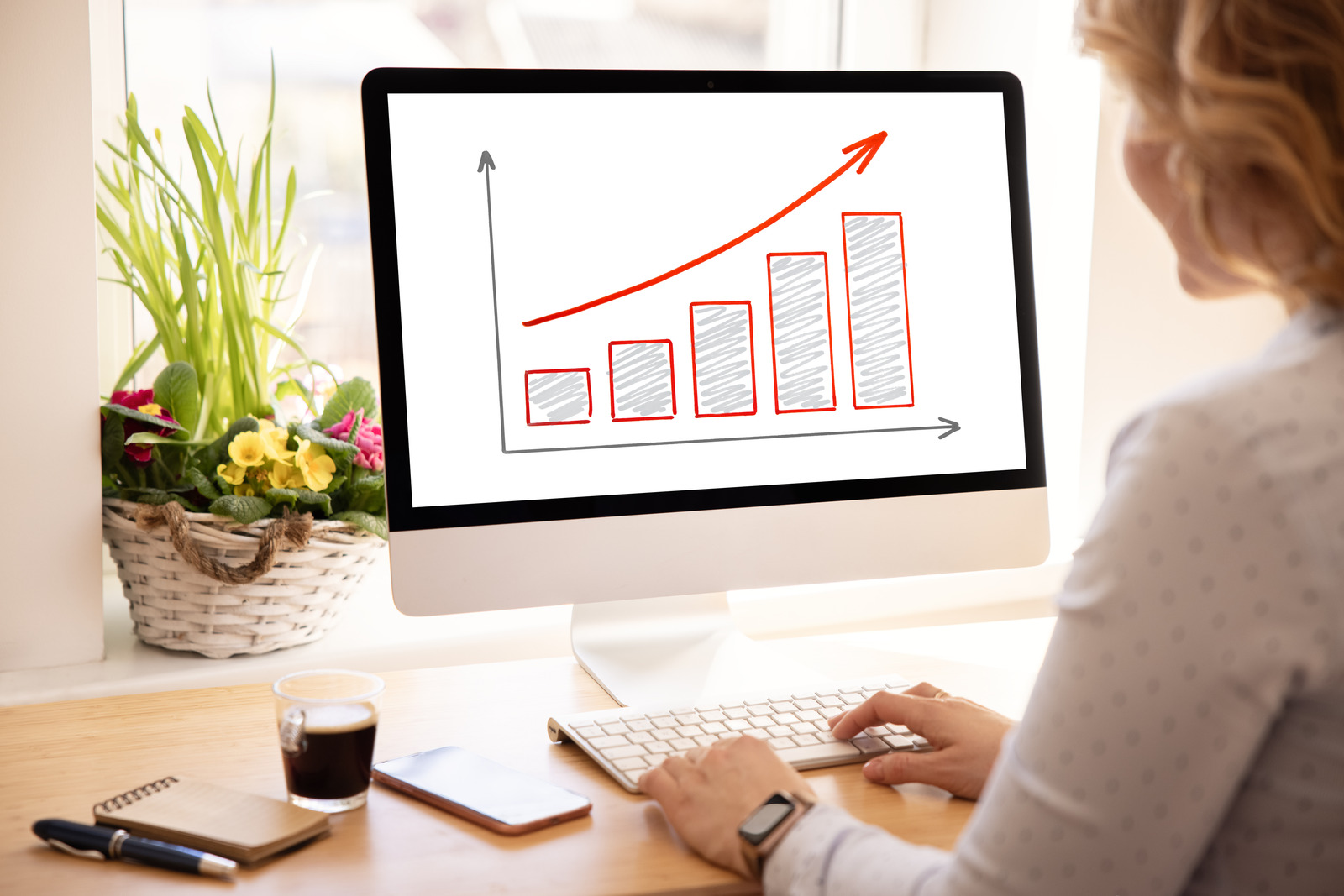 Amazon seller analyzing increasing sales graphs on analytics dashboard